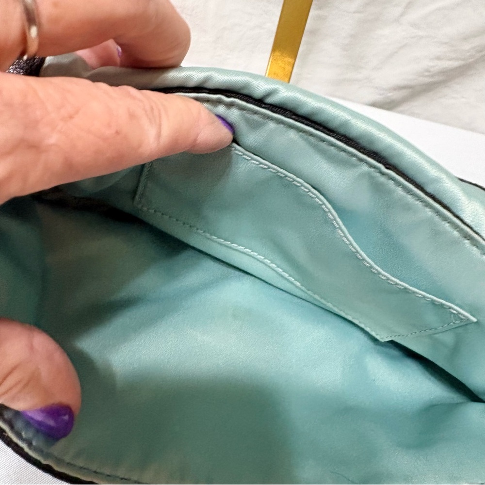 Black clutch wristlet, likely featuring silver-tone hardware - Picture 5 of 7